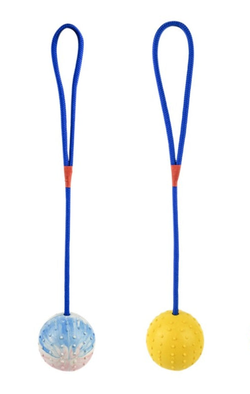 White or yellow natural rubber dog balls on rope - fetch and tug training toys for dogs