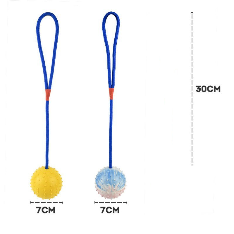 White or yellow natural rubber dog balls on rope - fetch and tug training toys for dogs