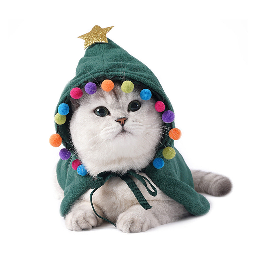 Cat wearing Christmas tree cape costume - festive holiday pet clothing