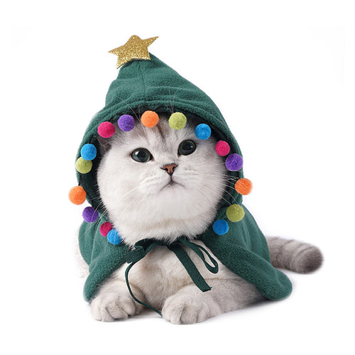 Cat wearing Christmas tree cape costume - festive holiday pet clothing